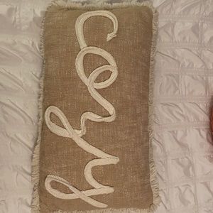 Beige throw pillow
